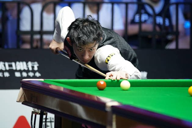 WUHAN, CHINA - AUGUST 24: Wu Yize of China plays a shot in the second round match against Artemijs Zizins of Latvia on day 2 of Wuhan Open 2026 at the Optics Valley Gymnasium of Huazhong University of Science and Technology on August 24, 2026 in Wuhan, Hubei Province of China.  Copyright: xTaixChengzhex 111661853313