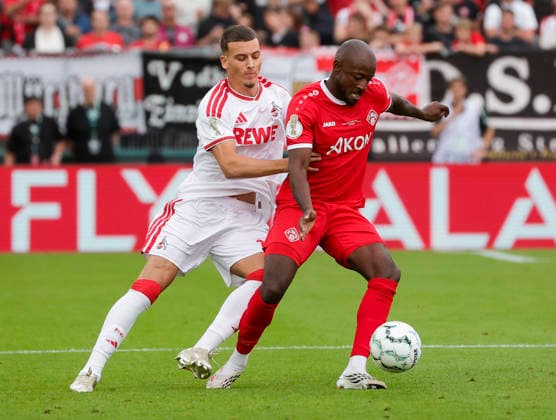 Im Bild: v.li. Said El Mala (1. FC Koeln, 10) gegen David Kinsombi (FC Wuerzburger Kickers, 8) am Ball 24.08.2026, FC Wuerzburger Kickers - 1. FC Koeln, DFB-Pokal, 1. Runde, Deutschland, Wuerzburg, AKON-Arena, DFL REGULATIONS PROHIBIT ANY USE OF PHOTOGRAPHS AS IMAGE SEQUENCES AND OR QUASI-VIDEO. *** Pictured from left: Said El Mala (1. FC Köln), 10, against David Kinsombi (FC Würzburger Kickers), 8, in possession of the ball on August 24, 2026, FC Würzburg Kickers vs. 1. FC Köln, DFB Cup, 1st Round, Germany, Würzburg, AKON Arena, DFL REGULATIONS PROHIBIT ANY USE OF PHOTOGRAPHS AS IMAGE SEQUENCES AND OR QUASI-VIDEO Copyright: HMBxMedia xJulienxBecker