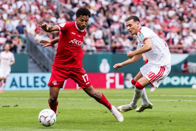 WUERZBURG, GERMANY - AUGUST 24: Liam Omore (Wuerzburger Kickers, 17) and Said El Mala (1. FC Koeln, 10) battle for the ball during the 1st round DFB Pokal match between Wuerzburger Kickers vs. 1. FC Koeln at AKON ARENA on August 24, 2026 in Wuerzburg, Germany. DFB REGULATIONS PROHIBIT ANY USE OF PHOTOGRAPHS AS IMAGE SEQUENCES AND OR QUASI-VIDEO. Bavaria Germany Copyright: xSteffiexWunderlx