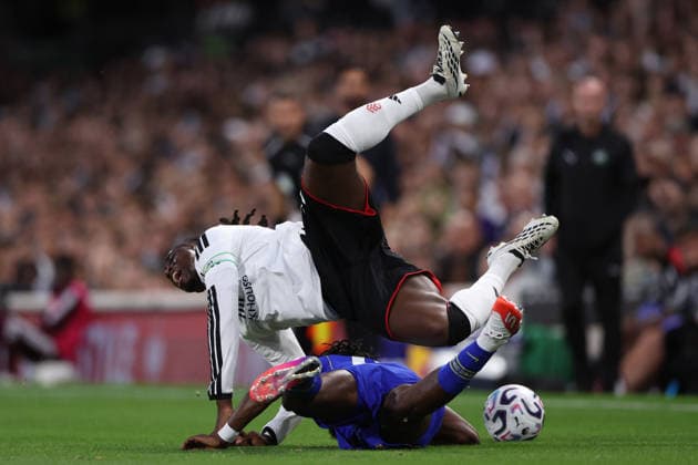 London, England, 24th August 2026. Calvin Bassey of Fulham is fouled by Romeo Lavia of Chelsea who is then shown a yellow card during the Fulham vs Chelsea Premier League match at Craven Cottage, London. Picture credit should read: David Klein Sportimage EDITORIAL USE ONLY. No use with unauthorised audio, video, data, fixture lists, club league logos or live services. Online in-match use limited to 120 images, no video emulation. No use in betting, games or single club league player publications. SPI_066_DK_Fulham_Chelsea SPI-4933-0066