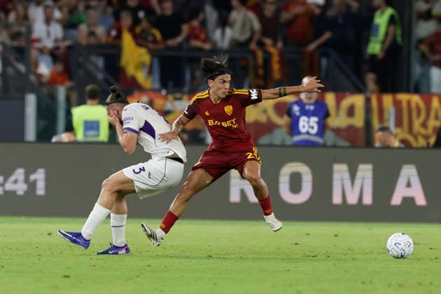 Italy: Serie a football match AS Roma vs Fiorentina Fiorentina s Romanian defender Radu Dragusin challenges for the ball with Roma™s Argentinian forward Paulo Dybala during the Serie A football match between AS Roma vs Fiorentina at the Olimpico Stadium in Rome, Italy on August 24, 2026. _BPH6239 Copyright: xAntonioxBalascox