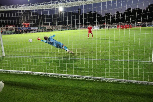 BERLIN, GERMANY - AUGUST 24: Elvis Rexhbecaj (Wolfsburg, 37) scores by 11m against goalkeeper goal keeper Luis Zwick (VSG Altglienicke, 1) in the goal, during the DFB Cup DFB Pokal match (Round 1) between DFB-Pokal: VSG Altglienicke - VfL Wolfsburg at Stadion auf dem Wurfplatz (Amateurstadion im Olympiapark) on August 24, 2026 in Berlin, Germany. DFL REGULATIONS PROHIBIT ANY USE OF PHOTOGRAPHS AS IMAGE SEQUENCES AND OR QUASI-VIDEO. Berlin Germany Copyright: xO.Frankex