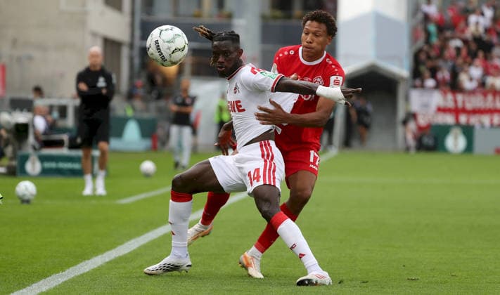 24.08.2026, xfsx, Herren, Fussball, Saison 2026 2027, DFB-Pokal, 1. Hauptrunde: FC Wuerzburger Kickers - 1. FC Koeln v.li.: Gideon Mensah (1. FC Koeln), Liam Omore (FC Wuerzburger Kickers) Wuerzburg AKON ARENA Bayern Deutschland *** August 24, 2026, xfsx, Men s, Soccer, 2026–2027 Season, DFB Cup, 1st Round: FC Würzburger Kickers vs. 1. FC Köln; Gideon Mensah (1. FC Köln), Liam Omore (FC Würzburger Kickers); Würzburg, AKON ARENA, Bavaria, Germany