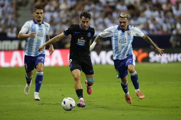 ESP: LaLiga EA Sports Malaga CF v Deportivo La Coruna Carlos Ruiz Chupete of Malaga, Adria Altimira of Deportivo La Coruna, Joaquin Munoz of Malaga during LaLiga EA Sports match between Malaga CF v Deportivo La Coruna played at La Rosaleda Stadium, Malaga on August 24 2026 in Spain Spain Soccer *** ESP LaLiga EA Sports Málaga CF vs. Deportivo La Coruna: Carlos Ruiz Chupete of Málaga, Adrià Altimira of Deportivo La Coruna, and Joaquín Munoz of Málaga during the LaLiga EA Sports match between Málaga CF and Deportivo La Coruna played at La Rosaleda Stadium, Malaga on August 24, 2026, in Spain. Spanish Soccer Copyright: xAgenciaxLOFx