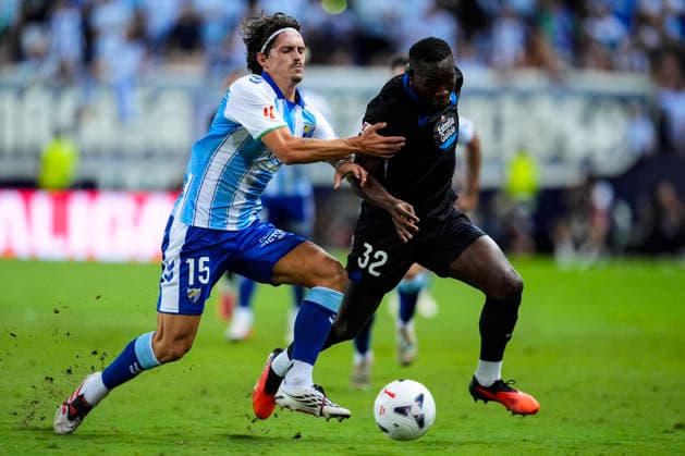 August 24, 2026, Malaga, Malaga, Spain: Angel Recio of Malaga CF and Bil Nsongo of RC Deportivo in action during the Spanish league, LaLiga EA Sports, football match played between Malaga CF and RC Deportivo at La Rosaleda stadium on August 24, 2026, in Malaga, Spain. Malaga CF V RC Deportivo - LaLiga EA Sports  - ZUMAa181 20260824_zaa_a181_155 Copyright: xJoaquinxCorcherox