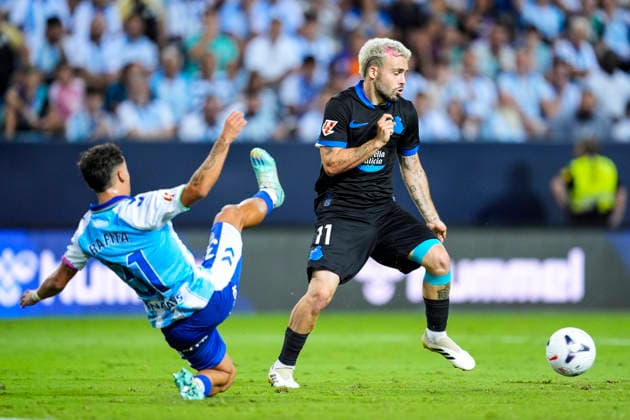 August 24, 2026, Malaga, Malaga, Spain: Rafita Garrido of Malaga CF and David Mella of RC Deportivo in action during the Spanish league, LaLiga EA Sports, football match played between Malaga CF and RC Deportivo at La Rosaleda stadium on August 24, 2026, in Malaga, Spain. Malaga Spain - ZUMAa181 20260824_zaa_a181_158 Copyright: xJoaquinxCorcherox