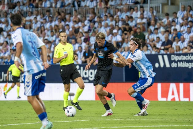 MALAGA, SPAIN - AUGUST 24: Asp - Jensen (N18) in action during La Liga match between Malaga and Deportivo de la Coruna at the Estadio de la Rosaleda on the 24th of august, 2026 in Malaga, Spain  Copyright: xAndresxLopezxSheridanxx xSPPx Sportspressphoto_SPR215208