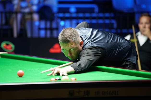 WUHAN, CHINA - AUGUST 25: Kyren Wilson of England plays a shot in the third round match against Ali Carter of England on day 3 of Wuhan Open 2026 at the Optics Valley Gymnasium of Huazhong University of Science and Technology on August 25, 2026 in Wuhan, Hubei Province of China.  Copyright: xTaixChengzhex 111662031242