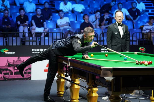WUHAN, CHINA - AUGUST 25: Kyren Wilson of England plays a shot in the third round match against Ali Carter of England on day 3 of Wuhan Open 2026 at the Optics Valley Gymnasium of Huazhong University of Science and Technology on August 25, 2026 in Wuhan, Hubei Province of China.  Copyright: xTaixChengzhex 111662031234