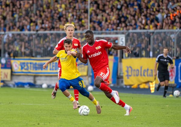 Soccer, Men s, 2026–2027 Season, DFB Cup First Round, Eintracht Braunschweig 1–2 FC Union Berlin, from left: Mehmet Aydin (Braunschweig), Ilyas Ansah (FC Union), August 23, 2026, Copyright: xMatthiasxKochx