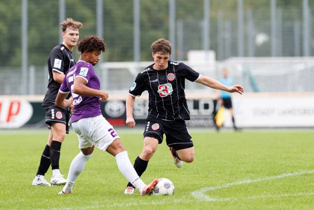 Benjamin Omenlo, 21, TSV Schwaben Augsburg, and Jakob Krauss, 6, TSV Schwaben Augsburg, during the match between TSV Landsberg and TSV Schwaben Augsburg, soccer, men s, Toto Cup, 2026–2027, Round of 16 on August 25, 2026, in Landsberg am Lech, Sportpark Bayern, Germany