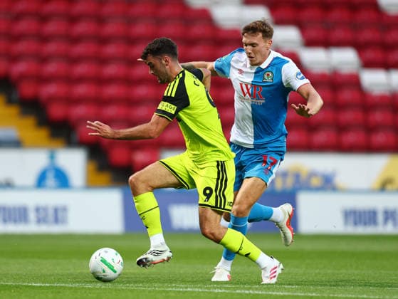 Blackburn, England, 25th August 2026. Tom Cannon of Sheffield United tackles Hayden Carter of Blackburn Rovers during the Blackburn Rovers vs Sheffield United Carabao Cup Second Round match at Ewood Park, Blackburn. Picture credit should read: Simon Bellis Sportimage EDITORIAL USE ONLY. No use with unauthorised audio, video, data, fixture lists, club league logos or live services. Online in-match use limited to 120 images, no video emulation. No use in betting, games or single club league player publications. SPI_003_SB_BBurn_Sheffield_Unnited SPI-4935-0003