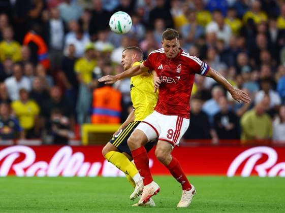 Chris Wood of Nottingham Forest and Nico Elvedi of Leeds United Nottingham Forest v Leeds United, EFL Carabao Cup, Second Round, Football, City Ground, Nottingham, UK - 25 Aug 2026Nottingham City Ground United Kingdom EDITORIAL USE ONLY No use with unauthorised audio, video, data, fixture lists, club league logos or live services. Online in-match use limited to 120 images, no video emulation. No use in betting, games or single club league player publications. Copyright: xMattxWest Shutterstockx 17115032ad