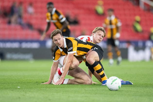 Stoke City v Hull City Carabao Cup Kieran Dowell of Hull City clashes with Luke Graham of Stoke City during the Carabao Cup Second Round match between Stoke City and Hull City at the bet365 Stadium, Stoke-on-Trent 25 08 2026 UK Newspapers OUT Copyright: xMattxWilkinsonx FIL-23823-0118