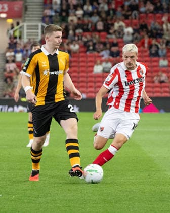 Stoke City v Hull City Carabao Cup Matt Targett of Hull City holds the ball up from a Stoke City player during the Carabao Cup Second Round match between Stoke City and Hull City at the bet365 Stadium, Stoke-on-Trent 25 08 2026 UK Newspapers OUT Copyright: xMattxWilkinsonx FIL-23823-0219