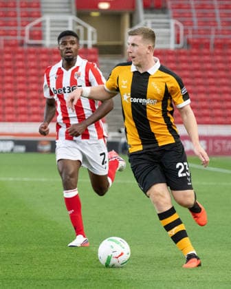 Stoke City v Hull City Carabao Cup Matt Targett of Hull City pushes forward ahead of Ben Johnson of Stoke City during the Carabao Cup Second Round match between Stoke City and Hull City at the bet365 Stadium, Stoke-on-Trent 25 08 2026 UK Newspapers OUT Copyright: xMattxWilkinsonx FIL-23823-0231