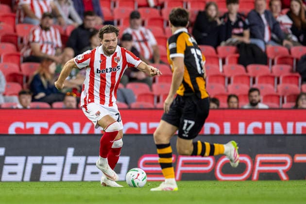 25th August 2026; Bet365 Stadium, Stoke, Staffordshire, England; Carabao Cup Football, Stoke City versus Hull City; Sam Gallagher of Stoke City under pressure from Paddy McNair of Hull City TimxWilliams
