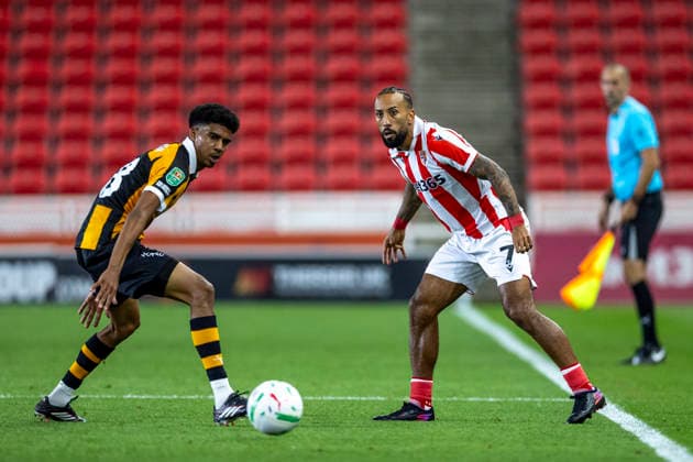 25th August 2026; Bet365 Stadium, Stoke, Staffordshire, England; Carabao Cup Football, Stoke City versus Hull City; Cody Drameh of Hull City and Sorba Thomas of Stoke City looks for the ball TimxWilliams