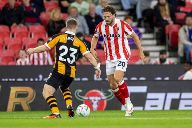 25th August 2026; Bet365 Stadium, Stoke, Staffordshire, England; Carabao Cup Football, Stoke City versus Hull City; Sam Gallagher of Stoke City under pressure from Matt Targett of Hull City TimxWilliams