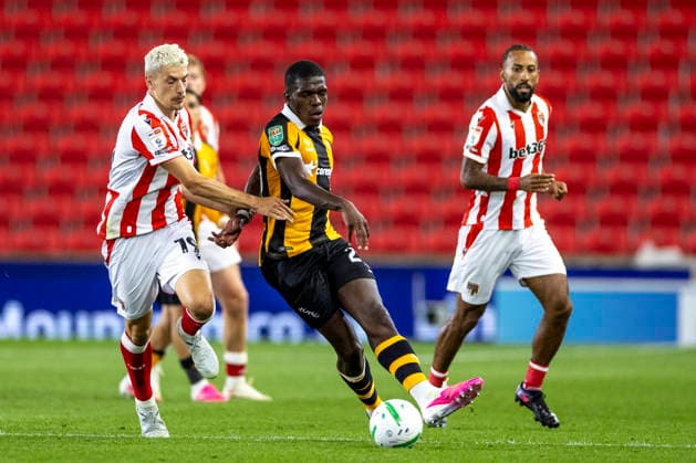 25th August 2026; Bet365 Stadium, Stoke, Staffordshire, England; Carabao Cup Football, Stoke City versus Hull City; Lucas Gourna-Douath of Hull City under pressure from Tomas Rigo of Stoke City TimxWilliams