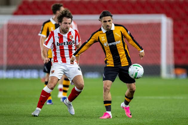 25th August 2026; Bet365 Stadium, Stoke, Staffordshire, England; Carabao Cup Football, Stoke City versus Hull City; Abdulkadir Omur of Hull City under pressure from Ben Pearson of Stoke City TimxWilliams