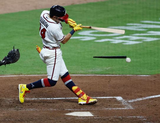 Shortstop Mauricio Dubon 14 of the Atlanta Braves grounded out and and breaks his bat in the eighth inning against the Los Angeles Dodgers the Atlanta Braves at Truist Park on Tuesday, August 25, 2026 in Atlanta, Georgia.  ATL20260825116 MikexZarrilli