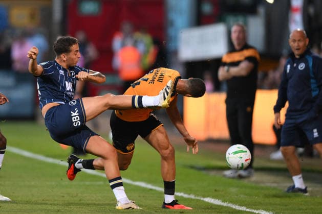 Cambridge United v Millwall - Carabao Cup Second Round Gassan Ahadme of Cambridge United is challenged by Alfie Massey of Millwall during the Carabao Cup Second Round match between Cambridge United and Millwall at the Cledara Abbey Stadium in Cambridge, on August 25, 2026. Cambridge Cambridgeshire  Copyright: xMIxNewsx originalFilename:fletcher-cambridg260825_npRtn.jpg