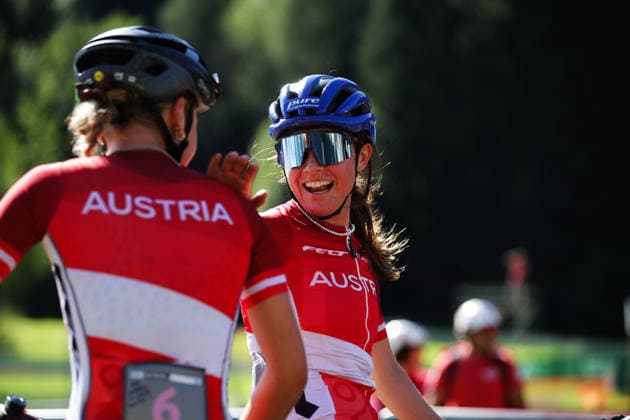 2026 UCI Mountain Bike World Championships Picture by Ed Sykes SWpix.com - 26 08 2026 - Cycling - 2026 UCI Mountain Bike World Championships - Val di Sole, Trentino, Italy - E-mountain bike (E-MTB) Cross Country - Women Elite - Anna Spielmann (Austria) wins to become World Champion and celebrates with Tamara Wiedmann (Austria) Copyright: x xSWpix.comx(t axPhotographyxHubxLtd)xEdxSykes SWpix.comx SWP-3030-19419