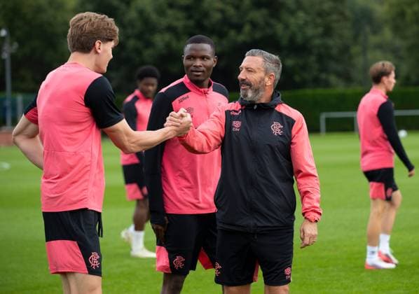 Rangers manager Derek McInnes shakes hands with Ryan Naderi at training ahead of tomorrow s UEFA Conference League qualifying match against Jablonec. Rangers Training - The Rangers Training Centre, Glasgow, Lanarkshire, Scotland, UK - 26 Aug 2026Glasgow The Rangers Training Centre Lanarkshire United Kingdom  Copyright: xO Rourke RangersxFC Shutterstockx 17117524w