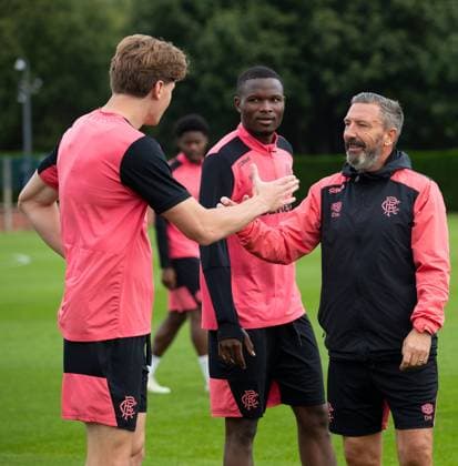 Rangers manager Derek McInnes shakes hands with Ryan Naderi at training ahead of tomorrow s UEFA Conference League qualifying match against Jablonec. Rangers Training - The Rangers Training Centre, Glasgow, Lanarkshire, Scotland, UK - 26 Aug 2026Glasgow The Rangers Training Centre Lanarkshire United Kingdom  Copyright: xO Rourke RangersxFC Shutterstockx 17117524u