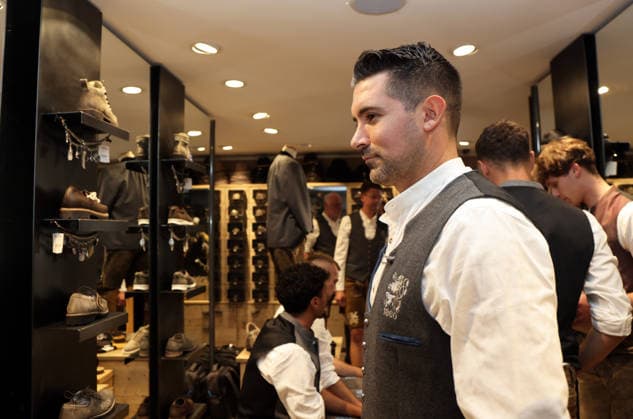 Soccer, Men s, Oktoberfest Attire, 2026–2027 Season, TSV 1860 Munich, Traditional Costumes by Angermaier Alper Kayabunar, TSV 1860 Munich Coach in Traditional Costume, Standing in Front of a Mirror Wearing Lederhosen