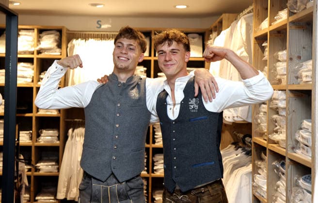 Soccer, Men s, Oktoberfest Outfits, 2026–2027 Season, TSV 1860 Munich, traditional costumes by Angermaier; Emre Erdogan (TSV 1860 Munich, left) and Julian Bell (TSV 1860 Munich, right) in traditional attire, wearing Lederhosen and standing, showing off their muscles, flexing