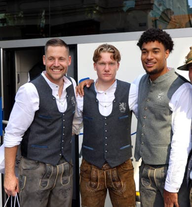 Soccer, Men s, Oktoberfest Uniforms, 2026–2027 Season, TSV 1860 Munich, traditional costumes by Angermaier, Vitus Eicher (TSV 1860 Munich) with Paul Bachmann (TSV 1860 Munich) and Arian Ortivero Calderon (TSV 1860 Munich), standing from left to right in traditional costumes and lederhosen