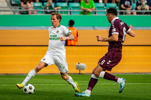 SOCCER - UEFA ECL, Rapid vs Hearts VIENNA,AUSTRIA,26.AUG.26 - SOCCER - UEFA Conference League, play-off, SK Rapid Wien vs Heart of Midlothian FC. Image shows Toni Adamsen (Rapid) and Oisin McEntee (Hearts).  GEPAxpictures xKevinxHackner