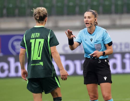 Referee Luliana Demetrescu (Romania), yellow card to Svenja Huth (VfL Wolfsburg), Soccer, Women, 2026–2027 Season, Women’s Champions League Qualifying, Round 3, VfL Wolfsburg vs. Inter Milan, 2–0