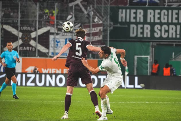Soccer Austria UEFA Conference League 2026–2027 Playoffs Second Leg, August 26, 2026 SK Rapid Vienna (Austria) vs. Heart of Midlothian FC (Hearts) (Scotland) Weststadion, Vienna, Austria Jamie McCart (Heart of Midlothian FC) with Ercan Kara (SK Rapid Vienna) Copyright: xLukasxBierederx
