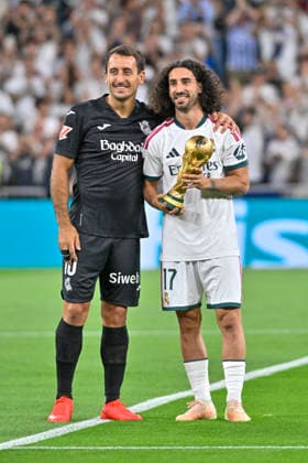 August 26, 2026, Madrid, Madrid, Spain: 10 MIKEL OYARZABAL of Real Sociedad SAD and 17 MARC CUCURELLA of Real Madrid CF with the World Cup trophy during the match on the second matchday of the 2026 27 National League First Division Championship between REAL MADRID C.F. and REAL SOCIEDAD, played at the Bernabo u Stadium on August 26, 2026, in Madrid, Spain. REAL MADRID C.F. Vs. REAL SOCIEDAD - 2026 27 National League First Division Championship (08 26 26)  - ZUMAc312 20260826_zsp_c312_073 Copyright: xOscarxManuelxSanchezx