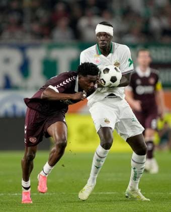Pierre Landry Kabore of Heart of Midlothian in action against Jakob Schöller of SK Rapid during a UEFA Conference League Play-Off Second Leg match between SK Rapid and Hearts at Weststadion on August 26, 2026 in Vienna, Austria. Rapid Vienna v Heart of Midlothian, UEFA Conference League, Play-Off Round, Second Leg, Football, Allianz Stadion, Vienna, Austria - 26 Aug 2026Vienna Allianz Stadion Austria  Copyright: xChristianxHofer Shutterstockx 17115048gg