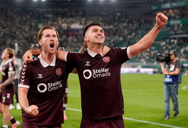 Jamie McCart (left) and Oisin McEntee of Heart of Midlothian celebrate after their side s victory over SK Rapid after a UEFA Conference League Play-Off Second Leg match between SK Rapid and Hearts at Weststadion on August 26, 2026 in Vienna, Austria. Rapid Vienna v Heart of Midlothian, UEFA Conference League, Play-Off Round, Second Leg, Football, Allianz Stadion, Vienna, Austria - 26 Aug 2026Vienna Allianz Stadion Austria  Copyright: xChristianxHofer Shutterstockx 17115048gv