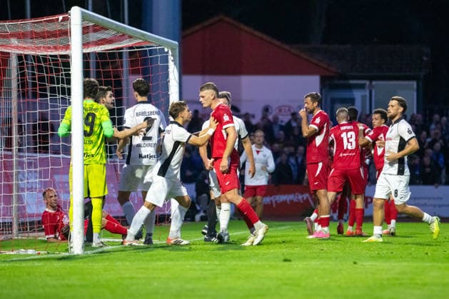 A scrum forms in Babelsberg’s penalty area; Paul Wegener (SVB, left) and Lukas Walchhütter (GFC, center) clash. GER, Soccer, Men’s, Northeast Regional League, 2026–2027 season, Greifswalder FC vs. SV Babelsberg 03, final score 2–1