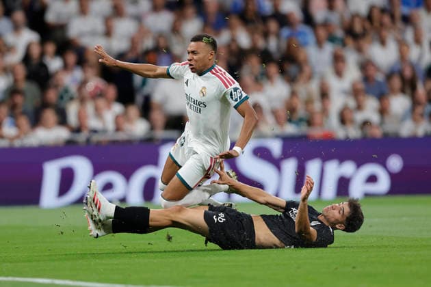 Kylian Mbappé of Real Madrid CF and Jon Martin of Real Sociedad battle for the ball during the LaLiga EA Sports match between Real Madrid CF and Real Sociedad de Fútbol at Estadio Santiago Bernabéu on August 26, 2026, in Madrid, Spain. Photo by Manu Reino, DeFodi Images