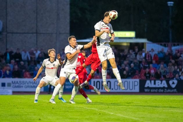 Gordon Büch (SVB), with Kay Seidemann (GFC) in the background; Maximilian Kalckreuth clears the ball with a header. GER, Soccer, Men s, Northeast Regional League, 2026–2027 Season, Greifswalder FC vs. SV Babelsberg 03, Final Score 2–1