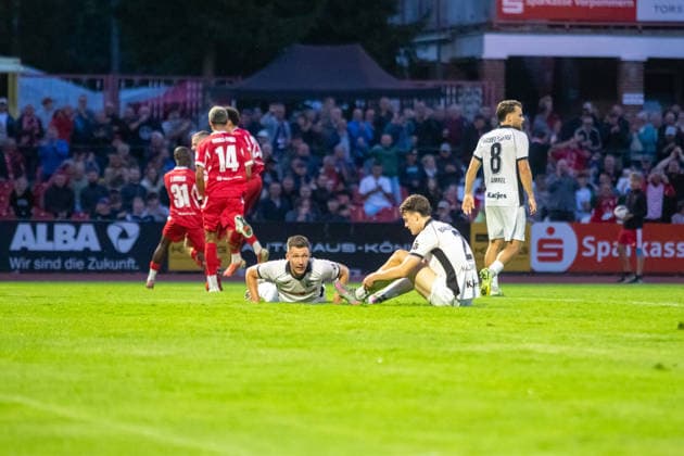 After Robert Leipert of GFC (not pictured) tied the game, two SVB players lie on the ground, visibly shocked. GER, Soccer, Men s, Northeast Regional League, 2026–2027 Season, Greifswalder FC vs. SV Babelsberg 03, Final Score 2–1
