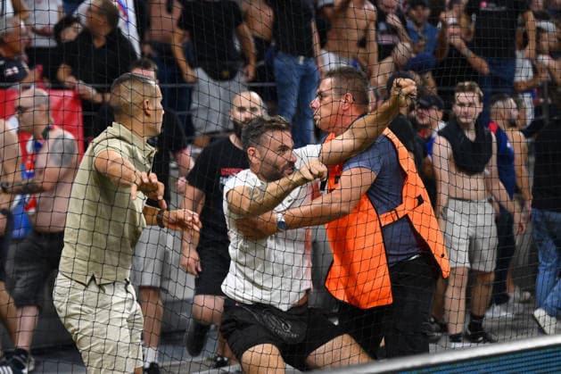 Olympique Lyon v Fenerbahce - UEFA Champions League LYON, FRANCE - AUGUST 26: A scuffle breaks out between Olympique Lyon fans and security personnel during the UEFA Champions League playoff round second-leg match between Olympique Lyon and Fenerbahce at Groupama Stadium in Lyon, France on August 26, 2026. Arif Hudaverdi Yaman Anadolu Lyon France. Editorial use only. Please get in touch for any other usage.  Copyright: x2026xAnadoluxArifxHudaverdixYamanx