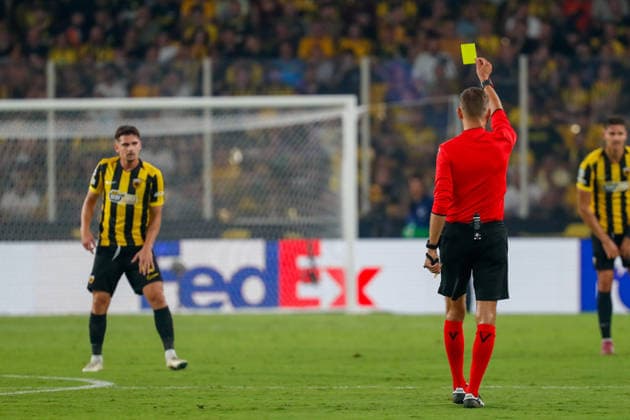 AEK Athens v PFC Levski Sofia UEFA Champions League Razvan Marin of AEK Athens receives a yellow card from Match referee Clément Turpin during the UEFA Champions League Play-Off Second Leg match at AEK Arena, Athens 26 08 2026 UK Newspapers OUT Copyright: xYannisxHalasx FIL-23829-0109