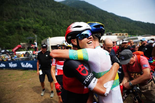 2026 UCI Mountain Bike World Championships Picture by Ed Sykes SWpix.com - 27 08 2026 - Cycling - 2026 UCI Mountain Bike World Championships - Val di Sole, Trentino, Italy - Cross-country Olympic (XCO) - Men Junior - Connor Wright (Australia) wins to become World Champion and celebrates with third place Marwan Barhoumi (Switzerland) Copyright: x xSWpix.comx(t axPhotographyxHubxLtd)xEdxSykes SWpix.comx SWP-3030-19926