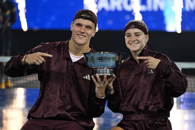 Karolína Muchová Jakub Menöík pose with the Championship Trophy after defeating Belinda Bencic Flavio Cobolli, 6-3, 1-6, 10-6 in Arthur Ashe Stadium on the Tuesday before the 2026 US Open Tennis Championship at the USTA Billie Jean King National Tennis Center in New York City on Tuesday, August 26, 2026.  NYP20260826301 LARRYxMARANO