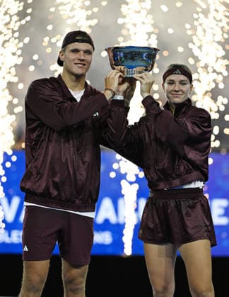 Karolina Muchova Jakub MenÅ¡ik pose with the Championship Trophy after defeating Belinda Bencic Flavio Cobolli, 6-3, 1-6, 10-6 in Arthur Ashe Stadium on the Tuesday before the 2026 US Open Tennis Championship at the USTA Billie Jean King National Tennis Center in New York City on Tuesday, August 26, 2026.  NYP20260826304 LARRYxMARANO