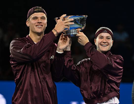 Karolína Muchová Jakub Menöík pose with the Championship Trophy after defeating Belinda Bencic Flavio Cobolli, 6-3, 1-6, 10-6 in Arthur Ashe Stadium on the Tuesday before the 2026 US Open Tennis Championship at the USTA Billie Jean King National Tennis Center in New York City on Tuesday, August 26, 2026.  NYP20260826309 LARRYxMARANO