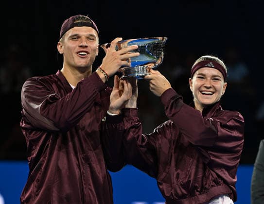 Karolína Muchová Jakub Menöík pose with the Championship Trophy after defeating Belinda Bencic Flavio Cobolli, 6-3, 1-6, 10-6 in Arthur Ashe Stadium on the Tuesday before the 2026 US Open Tennis Championship at the USTA Billie Jean King National Tennis Center in New York City on Tuesday, August 26, 2026.  NYP20260826310 LARRYxMARANO